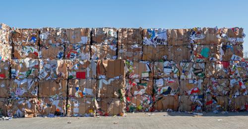 Piles of bundled, compressed recyclables.