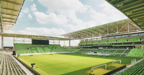 A green field on a soccer stadium