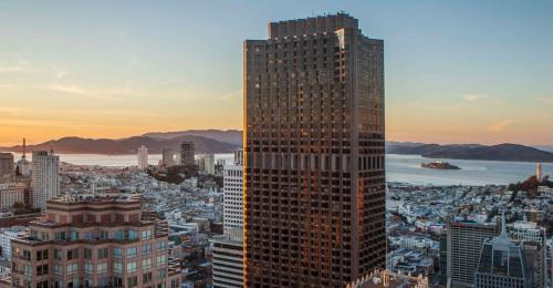 An office tower against a twilight skyline.