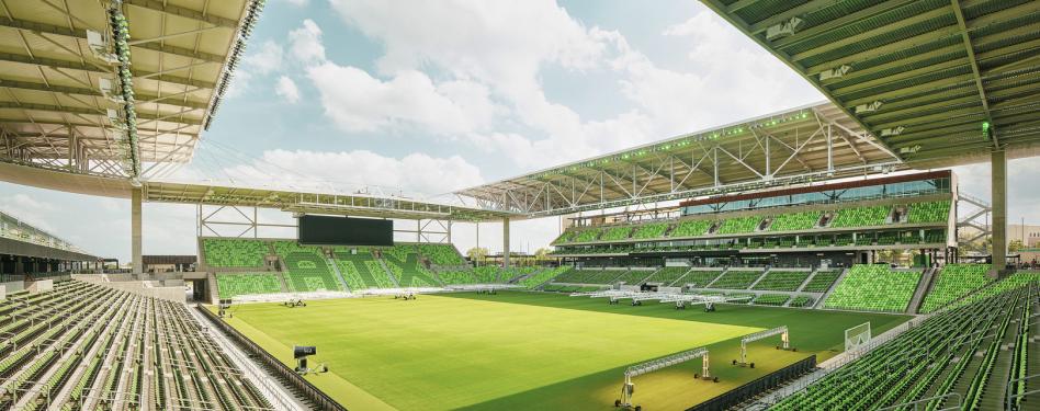 A green field on a soccer stadium
