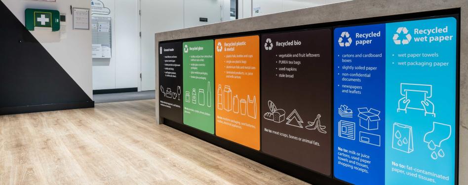 Recycling sorting bins inside a building.